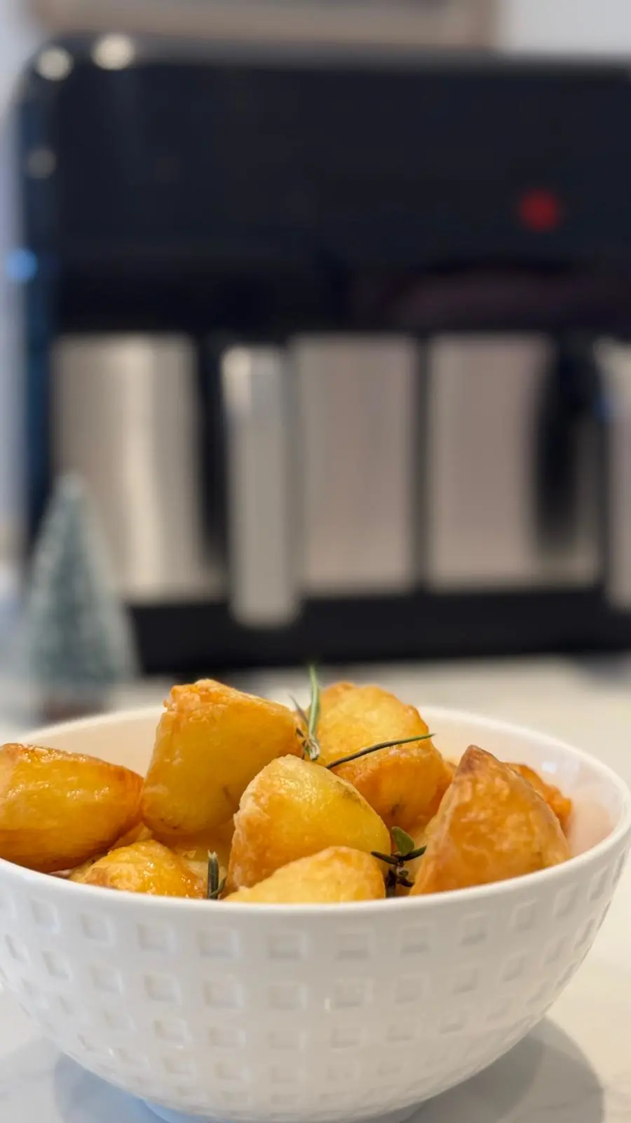 Roast potatoes in front of an air fryer